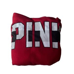 Pink brand sweatshirt, size large and is a red color